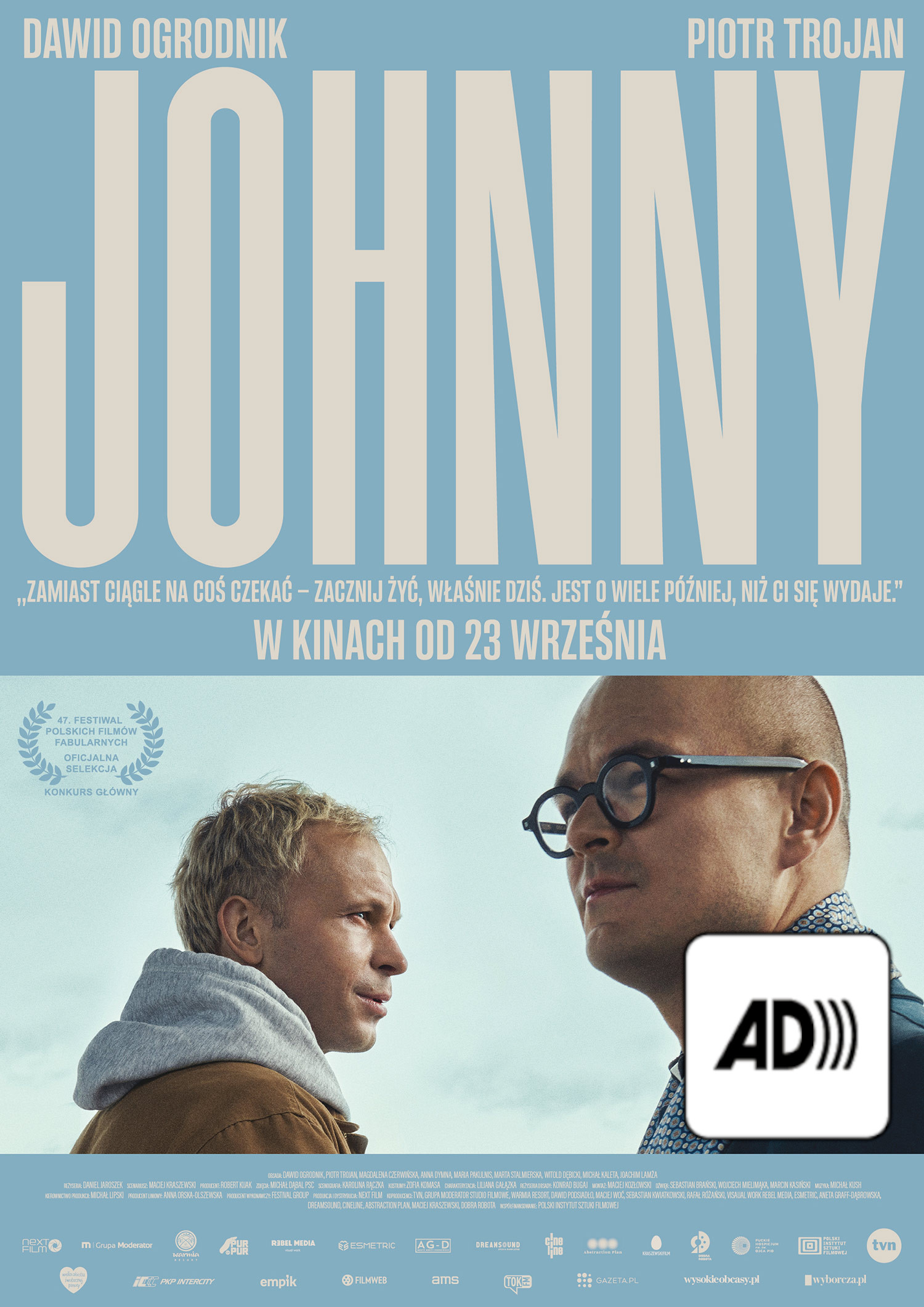 Plakat filmu Johnny. Plakat przedstawia dwóch mężczyzn stojących do siebie przodem na tle nieba.