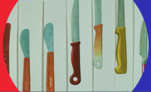 Kadr z filmu. Przedstawia rozdzielone liniami noże o różnych kształtach i barwach.