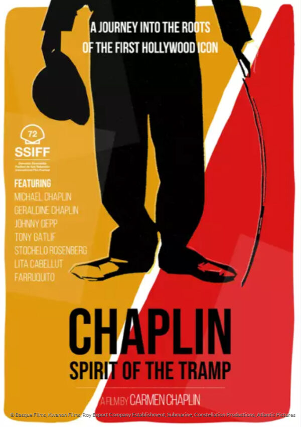 plakat. grafika - nogi Chaplina - czarne spodnie, melonik w ręku - na tle pomarańczowo-czerwonym.
