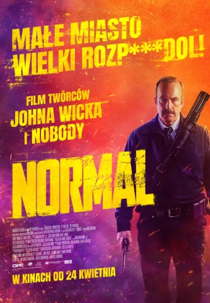 policjant, idzie w stronę widza, za nim kolory przypominające eksplozję