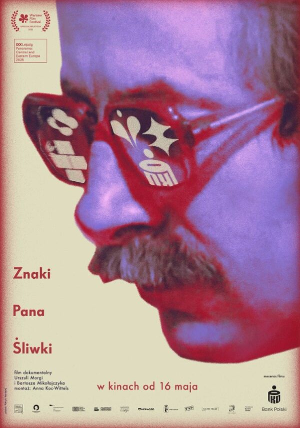 fioletowa grafika - mężczyzna z wąsem w okularach z profilu. w szkłach odbijają się znaki, m.in. pko.