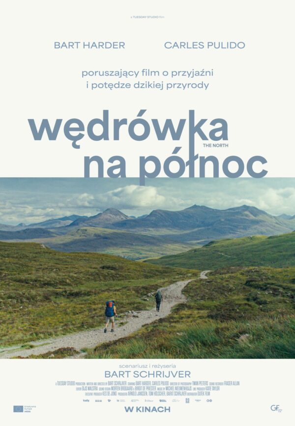 plakat. droga między górami, na niej widać dwóch idących mężczyzn.